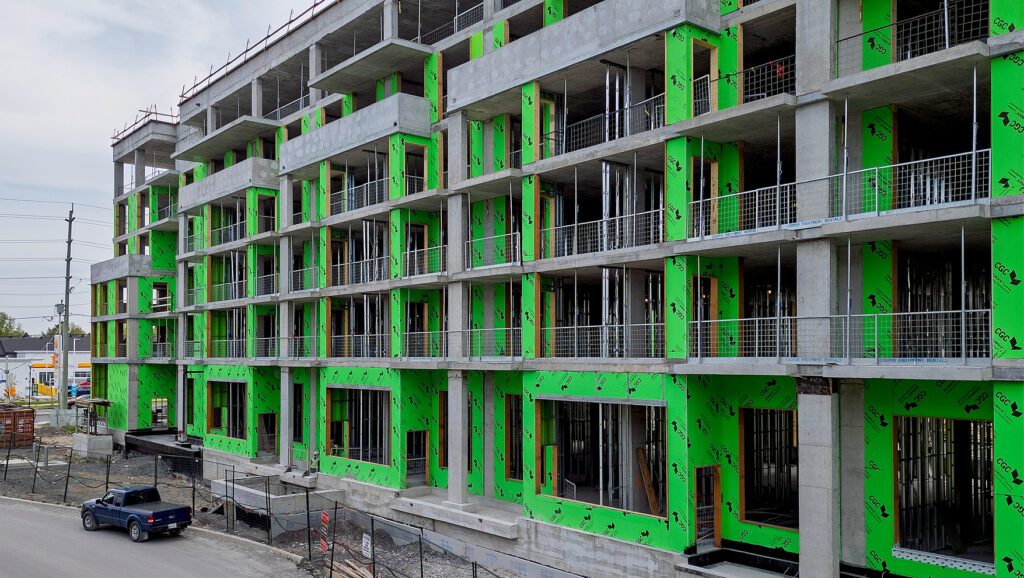 Photo of a multi-unit building under construction