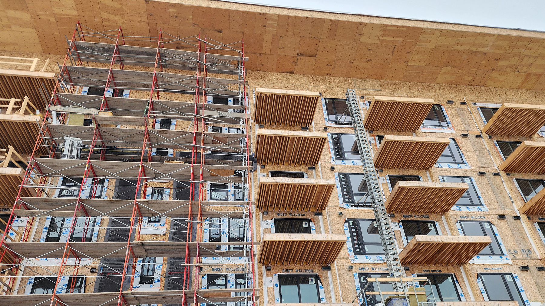 Cropped photo of the side of a multi-story building under construction